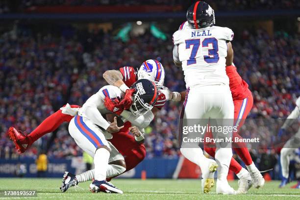 Tyrod Taylor of the New York Giants is sacked by AJ Epenesa of the Buffalo Bills in the first quarter of a game at Highmark Stadium on October 15,...