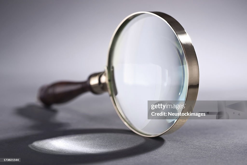 Magnifying glass over isolated background