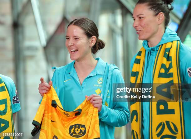 Carly Salmon, Goalkeeper/Midfielder of the CommBank ParaMatildas is presented with their playing kit by Elise Kellond-Knight of the CommBank Matildas...