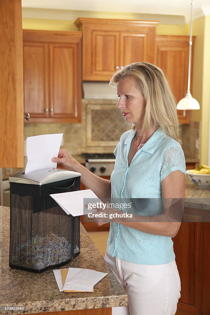Woman Using Paper Shredder