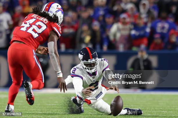 Tyrod Taylor of the New York Giants recovers his own fumble in the third quarter of a game against the Buffalo Bills at Highmark Stadium on October...