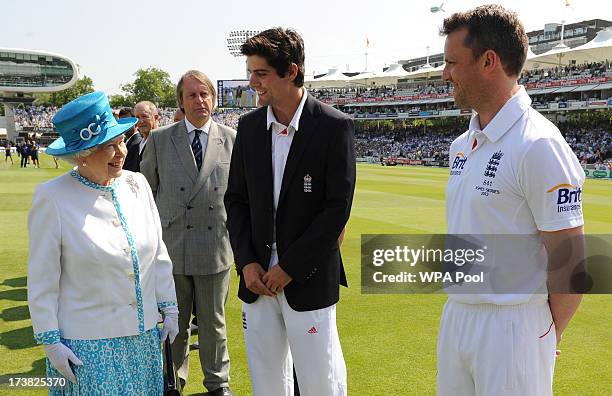 Queen Elizabeth II speaks with England captain Alastair Cook and Graeme Swann ahead of the first day of the second test between England and Australia...