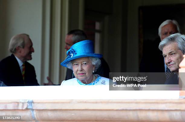 Queen Elizabeth II watches the match from the Pavilion on the first day of the second test between England and Australia at Lord's Cricket Ground on...