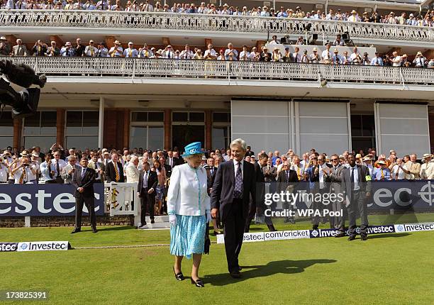 Queen Elizabeth II walks onto the field ahead of the first day of the second test between England and Australia at Lord's Cricket Ground on July 18,...
