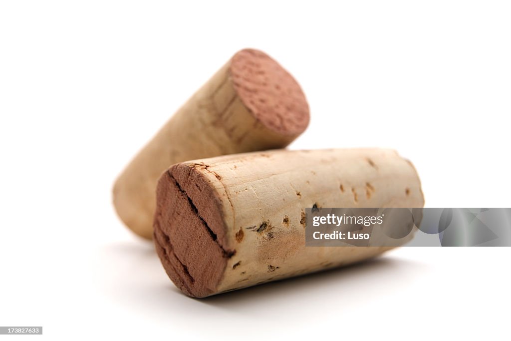 Close-up of two used wine corks