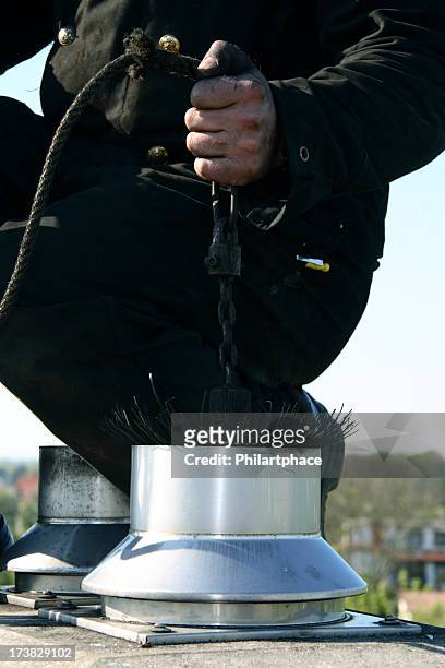 close up of a chimney sweep on the roof - 掃地 個照片及圖片檔