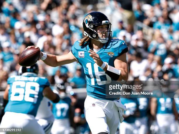 Quarterback Trevor Lawrence of the Jacksonville Jaguars on a pass play during the game against the Indianapolis Colts at EverBank Stadium on October...