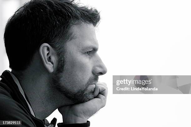 man in thought - hand on chin stock pictures, royalty-free photos & images