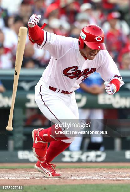 Kosuke Tanaka of the Hiroshima Carp hits a RBI single in the 8th inning against Yokohama DeNA Baystars during the Central League Climax Series first...