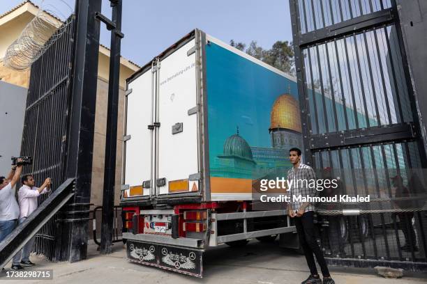 The second convoy of aid trucks cross the Rafah border from the Egyptian side on October 22, 2023 in North Sinai, Egypt. The aid convoy, organized by...