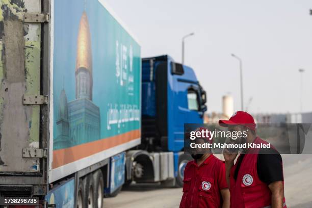 The second convoy of aid trucks cross the Rafah border from the Egyptian side on October 22, 2023 in North Sinai, Egypt. The aid convoy, organized by...