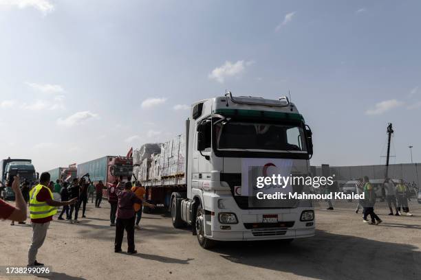 The second convoy of aid trucks cross the Rafah border from the Egyptian side on October 22, 2023 in North Sinai, Egypt. The aid convoy, organized by...