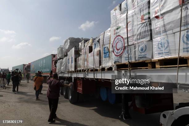 The second convoy of aid trucks cross the Rafah border from the Egyptian side on October 22, 2023 in North Sinai, Egypt. The aid convoy, organized by...