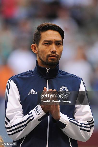 Jun Marques Davidson of the Vancouver Whitecaps claps during the singing of the national anthem prior to a match against Chicago Fire during an MLS...