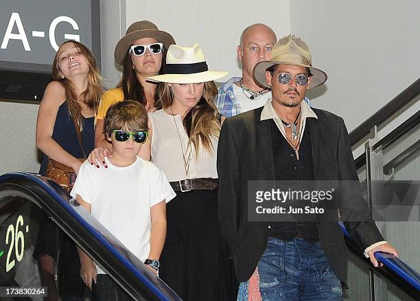 Johnny Depp, Amber Heard, Jack Depp and Lily Rose Melody Depp are seen upon departure at Narita International Airport on July 18, 2013 in Narita,...