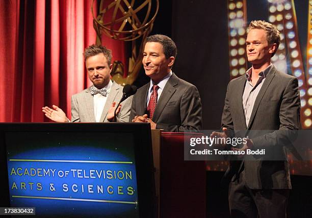 Actors Aaron Paul and Neil Patrick Harris , and Academy of Television Arts & Sciences Chairman & CEO Bruce Rosenblum speak onstage during the 65th...