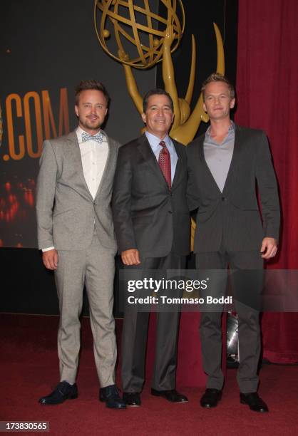 Actors Aaron Paul and Neil Patrick Harris , and Academy of Television Arts & Sciences Chairman & CEO Bruce Rosenblum pose onstage during the 65th...