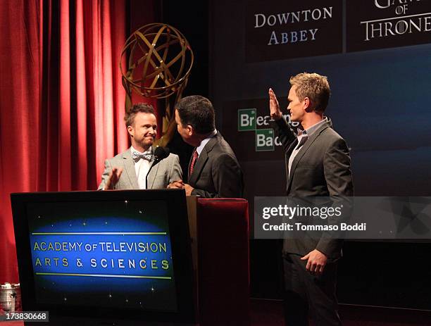 Actors Aaron Paul and Neil Patrick Harris , and Academy of Television Arts & Sciences Chairman & CEO Bruce Rosenblum speak onstage during the 65th...