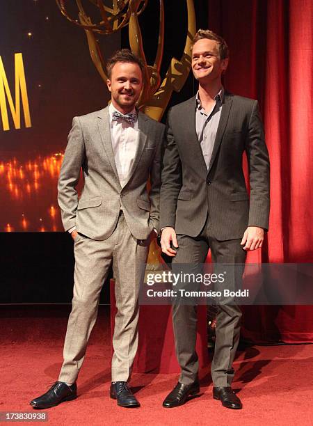 Actors Aaron Paul and Neil Patrick Harris pose onstage during the 65th Primetime Emmy Awards nominations at the Television Academy's Leonard H....