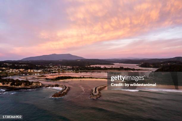 aerial view of the town of narooma in nsw at sunrise. - headland stock pictures, royalty-free photos & images