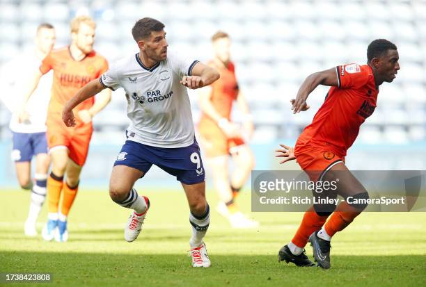 Preston North End's Ched Evans turns to evade Millwall's Wes Harding during the Sky Bet Championship match between Preston North End and Millwall at...