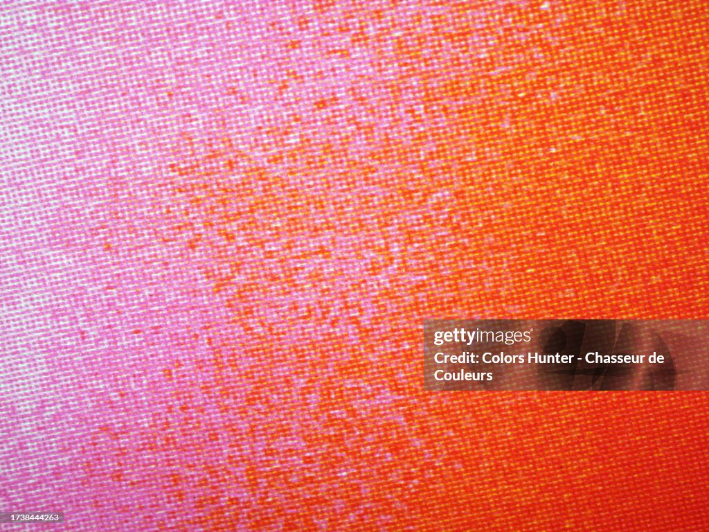 Very close-up of a poster printed in pink, orange and red tones using the offset technique in Paris, France