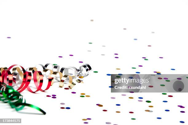 ribbon and confetti isolated on white - streamer stock pictures, royalty-free photos & images