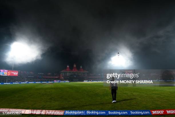 Fog hovers over the field during the 2023 ICC Men's Cricket World Cup one-day international match between India and New Zealand at the Himachal...