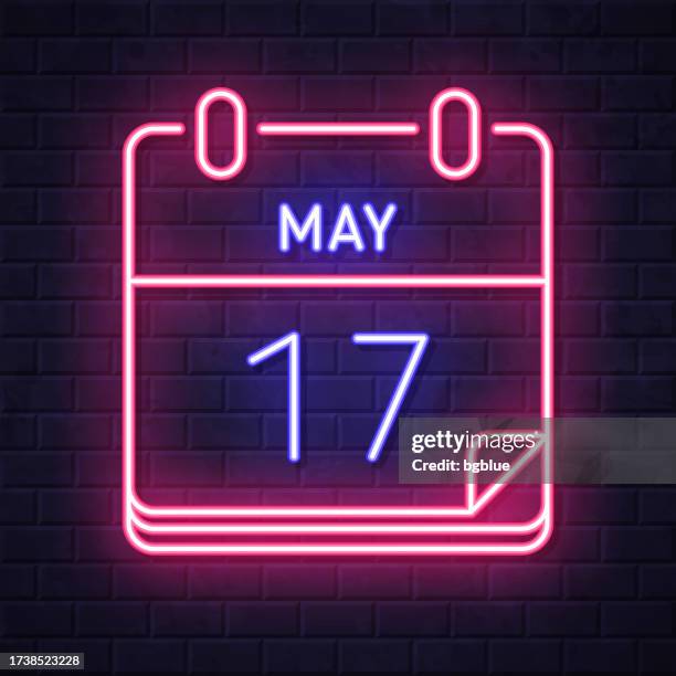 may 17. glowing neon icon on brick wall background - 17 may stock illustrations