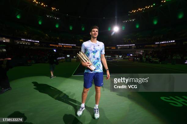 Hubert Hurkacz of Poland celebrates with the champion trophy after defeating Andrey Rublev in the Men's Singles Final match on Day 14 of 2023...
