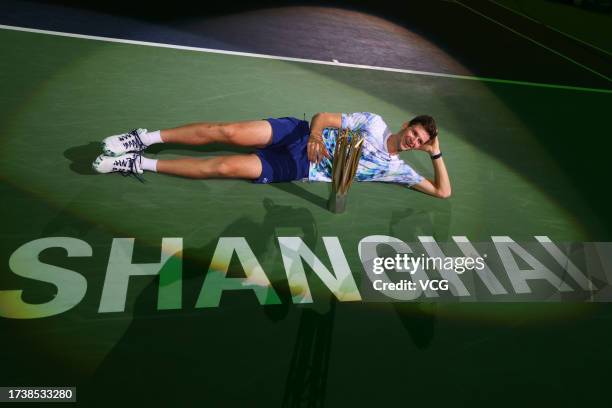 Hubert Hurkacz of Poland celebrates with the champion trophy after defeating Andrey Rublev in the Men's Singles Final match on Day 14 of 2023...