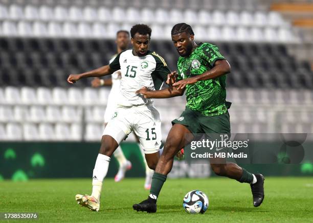 Terem Moffi of Nigeria competes for the ball with Abdullah Al-Khaibari of Saudi Arabia , during the International Friendly match between Saudi Arabia...