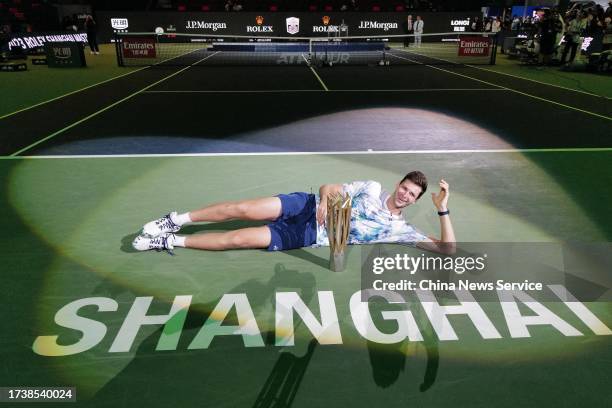 Hubert Hurkacz of Poland celebrates with the champion trophy after defeating Andrey Rublev in the Men's Singles Final match on Day 14 of 2023...