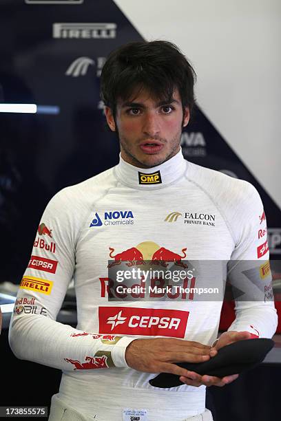 Carlos Sainz Jr of Spain prepares to drive for the Scuderia Toro Rosso team during the young drivers test at Silverstone Circuit on July 18, 2013 in...
