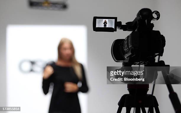 Model is filmed on a catwalk at the headquarters of Asos Plc in London, U.K., on Wednesday, July 17, 2013. Asos Plc, the U.K.'s largest online-only...