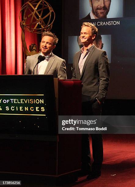 Actors Aaron Paul and Neil Patrick Harris speak onstage during the 65th Primetime Emmy Awards nominations at the Television Academy's Leonard H....