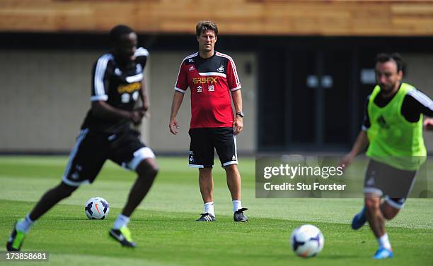 Swansea City manager Michael Laudrup looks on during training at Landore training complex on July 18, 2013 in Swansea, Wales.