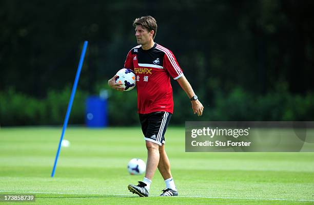 Swansea City manager Michael Laudrup looks on during training at Landore training complex on July 18, 2013 in Swansea, Wales.