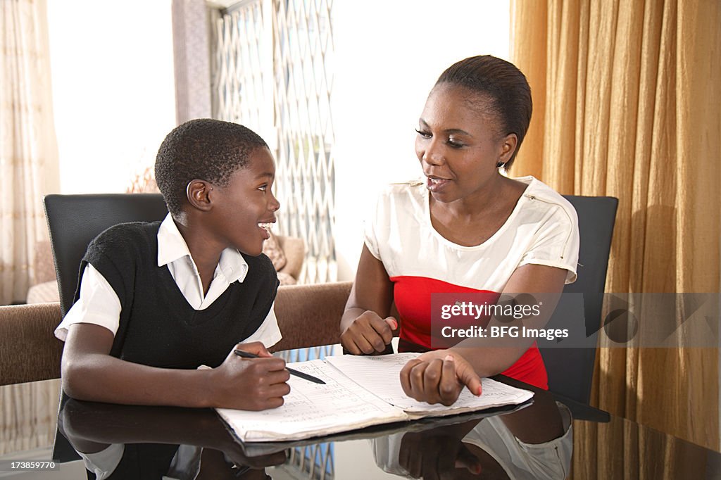 Mother and son doing homework, Cape Town, South Africa