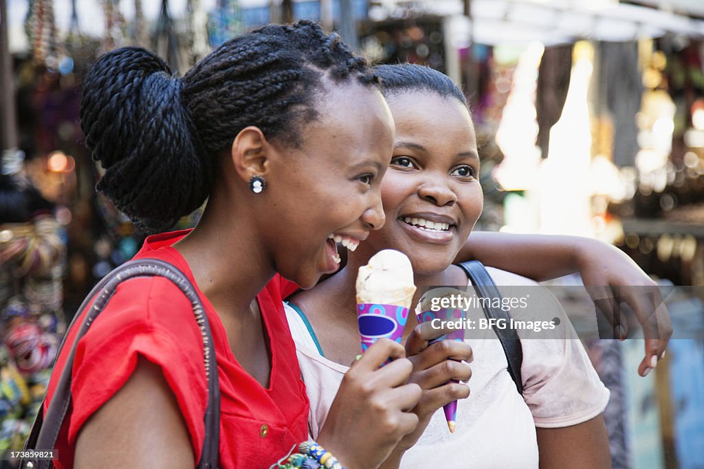 Two young women enjoying an ice-cream together. Cape Town Western Cape Province, South Africa