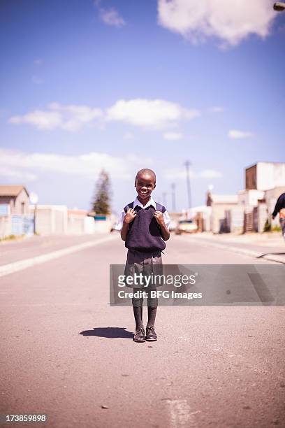 young school boy standing proudly in street in township - the project portraits stock pictures, royalty-free photos & images