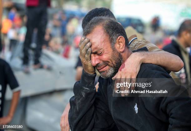 Man cries because his home was bombed during Israeli air raids in the southern Gaza Strip on October 16, 2023 in Khan Yunis, Gaza. Gazans are...