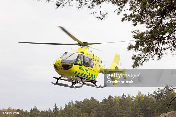 ambulans helicopter taking off. - air ambulance stock pictures, royalty-free photos & images