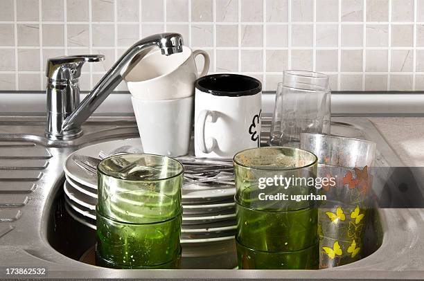 washing dishes - dirty sink stock pictures, royalty-free photos & images