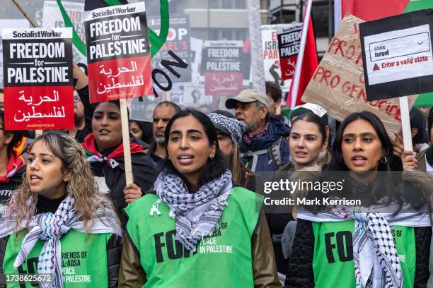 Pro-Palestinian protesters march through central London in support of the Palestinian population of Gaza on 21st October 2023 in London, United...