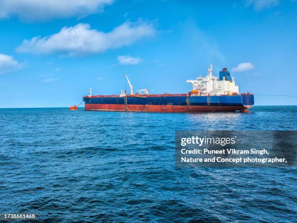 an oil tanker moored at a single point mooring system for unloading of crude in gujarat, india. - arabian sea stock pictures, royalty-free photos & images