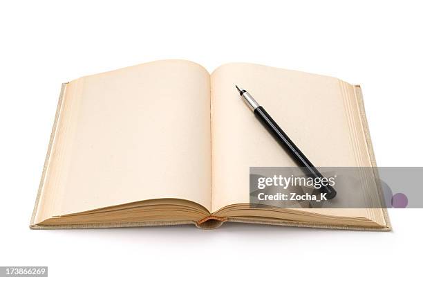 fountain pen on opened hardback book - old fountain pen stock pictures, royalty-free photos & images