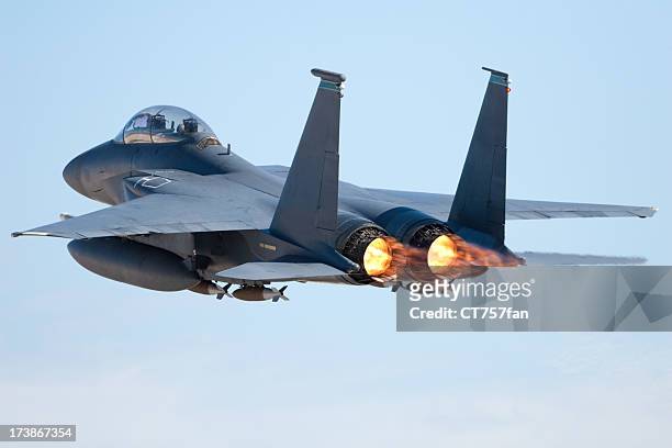 fighter jet in flight with afterburners activated - us air force stock pictures, royalty-free photos & images