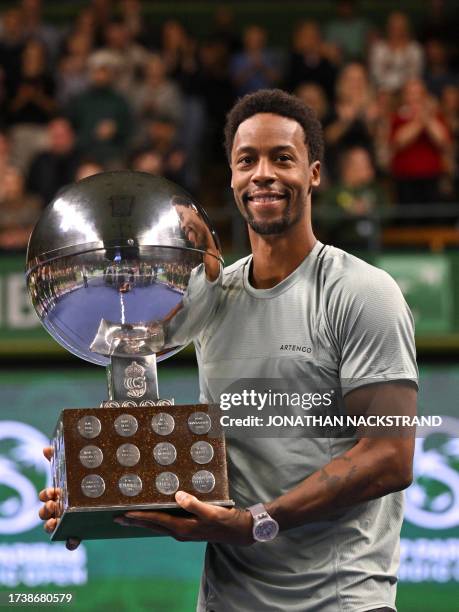 France's Gael Monfils poses with his trophy after winning against Russia's Pavel Kotov during the men's singles final match of the ATP Nordic Open...