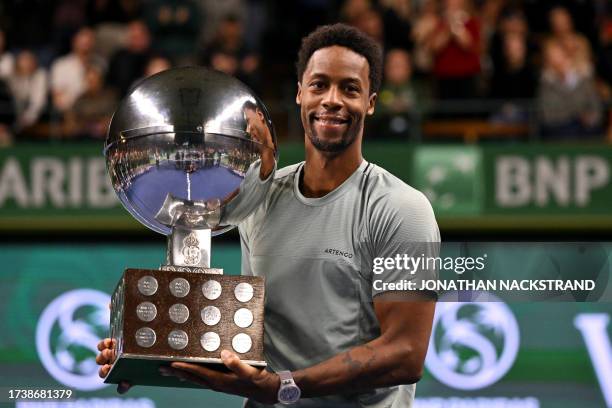 France's Gael Monfils poses with his trophy after winning against Russia's Pavel Kotov during the men's singles final match of the ATP Nordic Open...